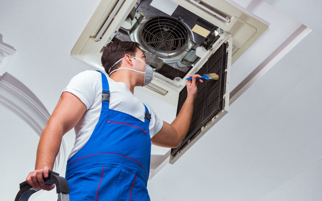 man-repairing-air-conditioner-1024x640